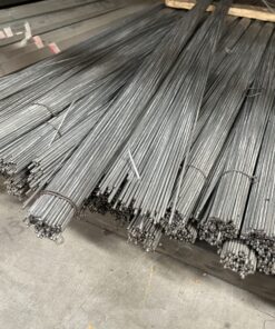 Bundles of straight galvanized hanger wires neatly organized in a warehouse setting.