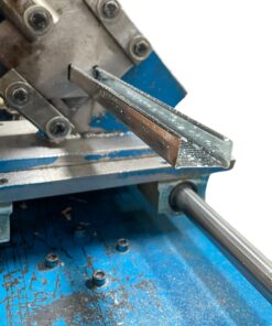 Steel brandering being manufactured, showing the crimping process.